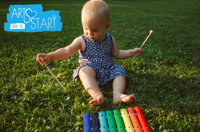 Baby play xylophone in the grass
